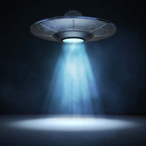 發光的UFO將光投射到黑暗的地板上。 — 太空船 壁紙