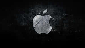 Apple標誌在深色紋理背景上 — 最佳筆電 壁紙
