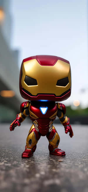人行道上發光胸口的Funko Pop鋼鐵人玩具 — 鋼鐵人標誌 壁紙