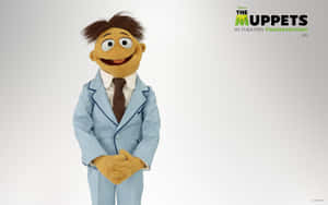 Muppet角色身穿藍色西裝和棕色領帶，對著鏡頭微笑。 — 妙妙熊仔 壁紙