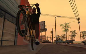 一個電子遊戲角色在日落時分的街道上拿著一輛黃色腳踏車。 — 腳踏車 GIF 壁紙