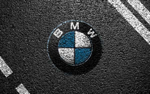 BMW標誌畫在瀝青路上帶有白色條紋 — Vans 標誌 壁紙