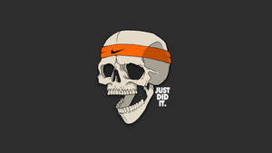 戴著橙色Nike頭帶的頭骨，旁邊有「JUST DID IT」文字。 — 高清骷髅 壁紙