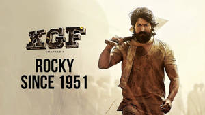 《KGF Chapter 1》中洛基手持錘子並帶有文字的電影海報。 — ASAP Rocky 壁紙
