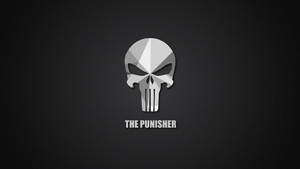深灰色背景上的銀色 Punisher 骷髏標誌，帶白色文字。 — 漫威標誌 壁紙