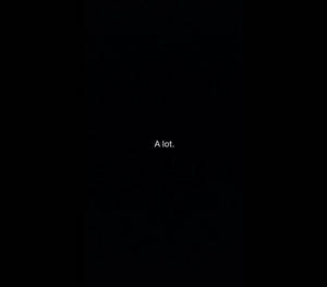 黑色背景，中央白色文字寫著「A lot.」 — 黑色桌面 壁紙