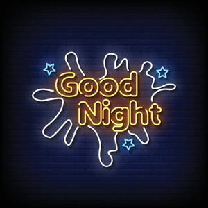 夜間磚牆上帶有星星的霓虹燈牌寫著 Good Night — 晚安 壁紙