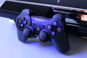 黑色PlayStation 4控制器帶有發光按鈕，旁邊是主機。 — 酷炫遊戲 壁紙