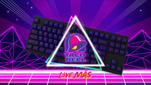 一個黑色鍵盤，在網格背景上的霓虹三角形中有 Taco Bell 標誌。 — 塔可 壁紙