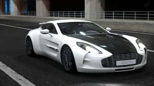 白色 Aston Martin One-77 在夜間黑暗賽道上疾馳。 — 奧斯頓馬丁 壁紙