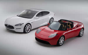 兩輛 Tesla 電動車 白色轎車和紅色敞篷車 在攝影棚內 — MacBook Pro M1 壁紙
