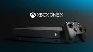 黑色 Xbox One X 主機和控制器，深藍色漸變背景。 — 高畫質遊戲 壁紙