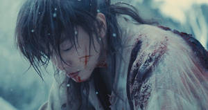 雪地中一名衣衫襤褸、表情陰沉的血人。 — 浪人劍心 壁紙