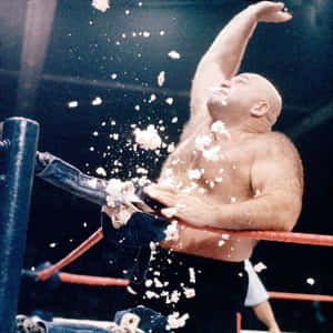 摔角手在擂台上拋爆米花慶祝勝利。 — WWE GIF 壁紙
