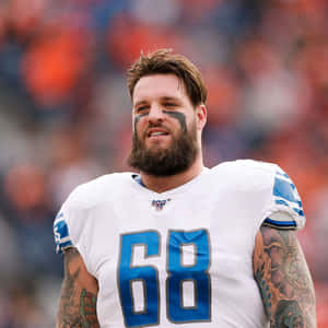 身穿68號球衣的NFL足球員，有刺青和臉部彩繪。 — 運動 壁紙