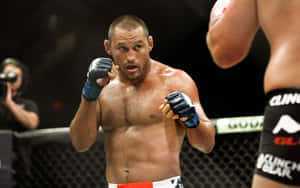 MMA拳手在籠中進行激烈比賽 — 運動 壁紙