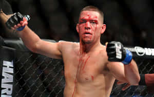 MMA拳手滿臉鮮血在UFC八角籠中慶祝勝利。 — 終極格鬥冠軍賽 壁紙