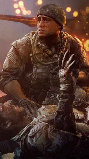 士兵在戰場上跪在倒下的戰友身旁。 — 電玩遊戲 GIF 壁紙
