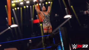 摔角手在燈光明亮的摔角擂台上慶祝勝利。 — WWE GIF 壁紙