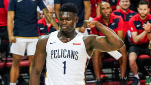 籃球運動員在比賽中穿著Pelicans球衣彎曲二頭肌。 — 錫安·威廉森 壁紙