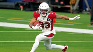 足球員在球場上帶球奔跑 — NFL 美式足球 壁紙