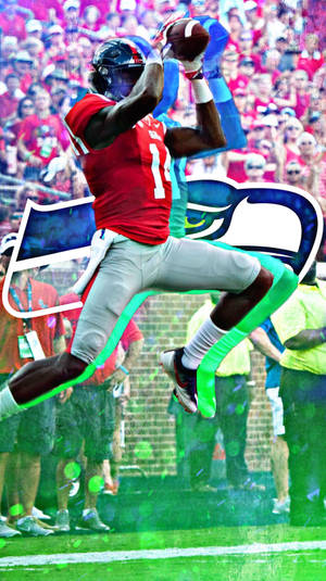 美式足球員在比賽中接住傳球，背景有球迷。 — Dk Metcalf 壁紙