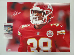 已簽名NFL美式足球員照片，身穿紅色28號球衣。 — 運動 壁紙