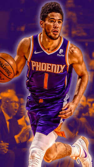 身穿紫色球衣的籃球運動員在比賽中運球。 — Devin Booker 壁紙