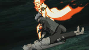 忍者手持刀刃對著倒下的同伴，火焰狐靈懸浮在上方。 — 火影忍者 卡卡西 壁紙