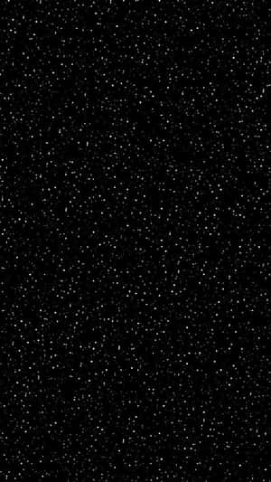黑色背景上佈滿了類似星星的細小白色斑點。 — 星星 壁紙