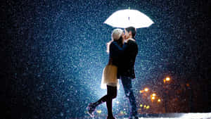 情侶在雨傘下接吻，夜晚下雪，有路燈。 — 情侶 壁紙