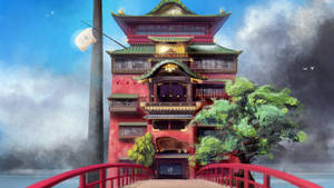 紅色橋樑通往傳統的日本寶塔，綠色屋頂，周圍霧氣繚繞。 — 神隱少女 壁紙