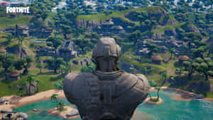 巨大的石像俯瞰著一個熱帶Fortnite島嶼，島上有棕櫚樹和藍色海水。 — 要塞英雄 大逃殺 壁紙