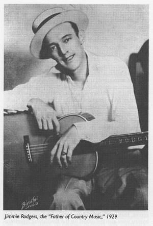 Jimmie Rodgers 在 1929 年的復古錄音室肖像中拿著吉他。 — 亞倫·羅傑斯 壁紙