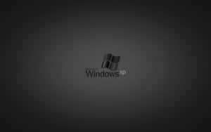 Microsoft Windows XP 標誌在深灰色漸層背景上 — 深色窗戶 壁紙
