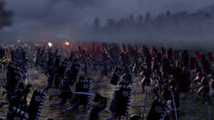 武士軍隊在黃昏時分的霧氣田野中衝鋒，紅旗和黑色盾牌。 — 暮光 壁紙
