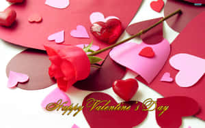 紅玫瑰和紙心，帶有 'Happy Valentine's Day' 文字，適合浪漫慶祝。 — 16:10 壁紙
