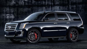 黑色Hennessey Cadillac Escalade配備紅色制動卡鉗，停在深色牆前。 — 凱迪拉克 壁紙