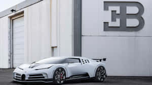 白色Bugatti超級跑車停在帶有大型B標誌的工廠外。 — 布加迪 GIF 壁紙