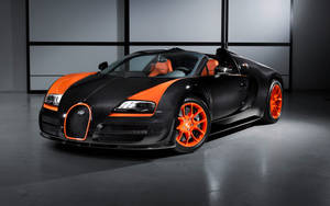 極簡主義工作室中的黑色和橙色Bugatti Veyron超級跑車。 — Bugatti iPhone 壁紙