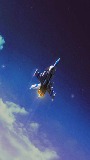 一架戰鬥機在夜間飛行，引擎發光，背景是星空和雲層。 — 空軍 壁紙