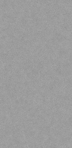 灰色紋理壁紙，帶有細微斑點圖案，適合現代室內設計。 — Pixel 4 壁紙