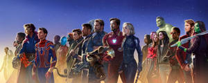 穿著超級英雄服裝的Marvel英雄們在星空下英勇地排成一列。 — 漫威復仇者聯盟 壁紙