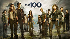 《The 100》的演員們站在一個反烏托邦背景的岩石山上。 — 電視 壁紙