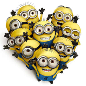 一群穿著藍色工裝褲的黃色Minions揮手微笑。 — 超人特攻隊 壁紙