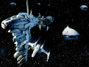 星艦在發光引擎的死星附近太空戰鬥。 — 星際大戰 壁紙