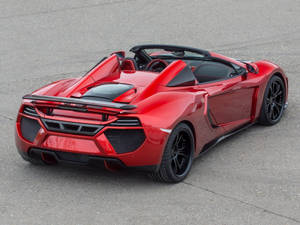 紅色McLaren敞篷跑車，黑色輪胎，停在瀝青上。 — 麥拉倫 壁紙
