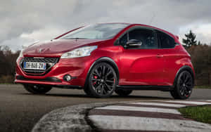 紅色Peugeot 208 GT Line停泊在賽道邊緣，天空多雲。 — Steam Deck OLED 壁紙