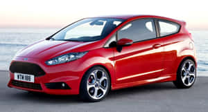 日落時分海邊停泊的紅色福特 Fiesta ST — 好看汽車 壁紙