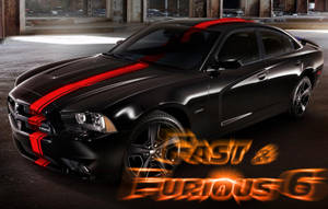 黑色Dodge Charger在黑暗倉庫中帶有紅色條紋，Fast & Furious 6標誌。 — 玩命關頭 壁紙